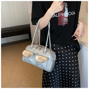 Detail of silver oil wax leather Boston bag with vintage metallic finish and front pockets