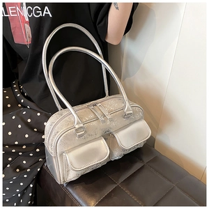 Detail of silver oil wax leather shoulder bag featuring vintage cracked texture and dual pockets