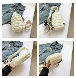 Detail views of white quilted crossbody bag with pleated strap and adjustable buckle