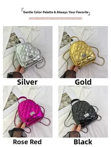 Detail view of quilted chain backpacks in silver, gold, rose red, and black finishes