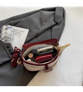 Interior view showing the storage capacity of the two-tone bucket bag for essentials