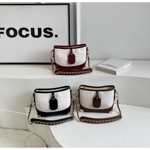 Three-color variety of bucket bags with contrast trim and metal chain straps