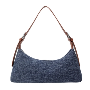 Retro crescent denim underarm bag with brown leather strap on a clean white background