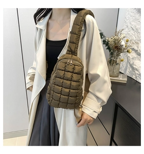 Close-up of a dark brown quilted puffer crossbody bag with a high-quality nylon texture