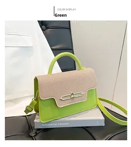 Close-up of green PU leather crossbody bag with woven flap and gold buckle detail