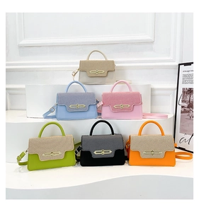 Detail of color-block flap bags in six colors with woven textures and gold metal locks