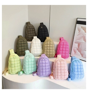 Macro shot showing diverse colors of lightweight quilted nylon crossbody chest bags
