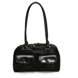 Glossy black bowling handbag with twin flap pockets and silver metal rings