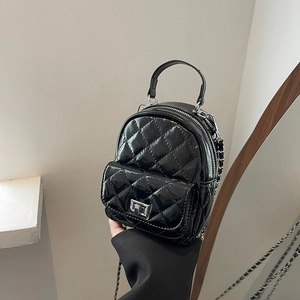 Chic black quilted faux leather mini backpack with silver chain straps and metal lock