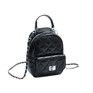 Chic black quilted mini backpack with silver chain strap and polished leather finish