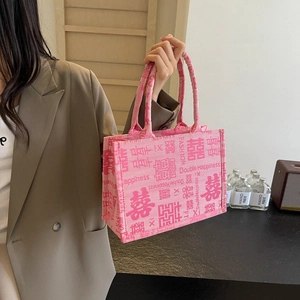 Rosa chinesische Hochzeitstasche mit Stickerei und stilvollem Doppelglück-Motiv