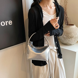 Silver metallic crossbody bag with textured wrinkles and sleek shoulder strap