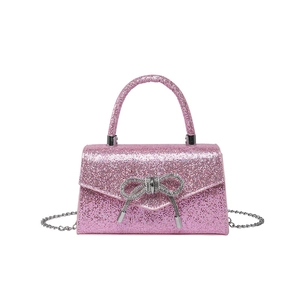 Sparkly pink sequin mini handbag with crystal bow detail and silver chain strap