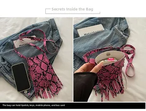 Pink snakeskin pattern phone bag with fringe detailing and magnetic closure interior view