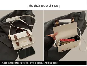 Detail view of cream vintage crossbody bag showing spacious interior for smartphone