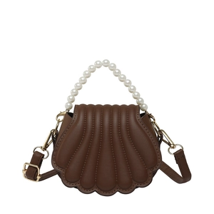 Brown shell-shaped crossbody bag with pearl handle and stylish pleated faux leather detail