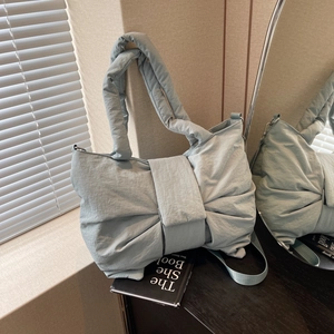 Stylish light blue bow-shaped nylon shoulder bag with oversized puffy pleated design