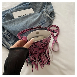 Internal view of pink snakeskin mini bag showing capacity for a smartphone