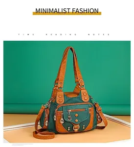 Detail of vintage green washed leather tote featuring multiple pockets and bronze rivets