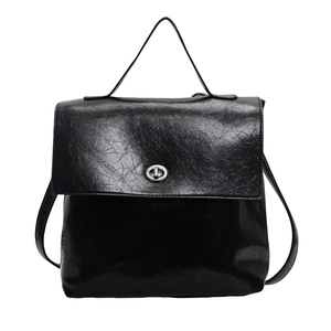 Sac à dos rétro en cuir noir avec finition cirée brillante et fermoir rotatif argenté