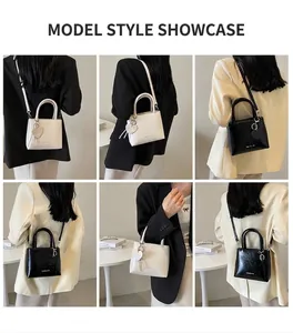 Detailed views of stylish mini bucket bags in black and white with heart charms