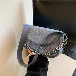 Fashionable denim crescent underarm bag with silver chain and blue leather strap