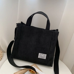Minimalistische schwarze Cord-Einkaufstasche mit verstellbarem Schultergurt für Damen