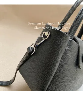 Close-up of black lychee grain leather bucket bag with premium silver metal hardware