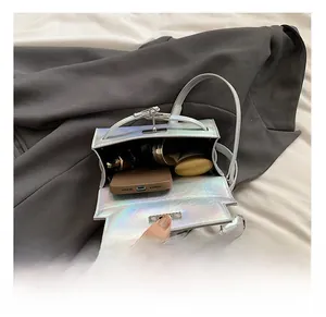 Interior view showing the storage capacity of the silver leather crossbody bag