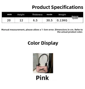 Pink crescent underarm bag with black bows, heart pendant and size chart details
