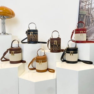Chic color-block cylinder shoulder bags in various leather and canvas finishes