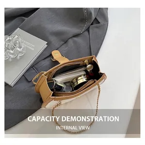Detail showing high-capacity interior of beige patchwork leather bag with daily essentials