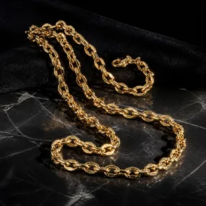 Close-up of elegant gold chain strap detail on luxury velvet evening handbag