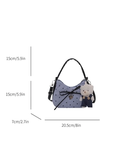 Blue striped canvas tote with black heart prints and a cute plush bear charm accessory