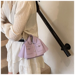 Detail of lavender jacket-shaped handbag featuring silver chain and metal button accents