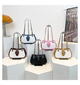Detailed display of five colorful quilted crossbody bags with gold chain straps on white pedestals