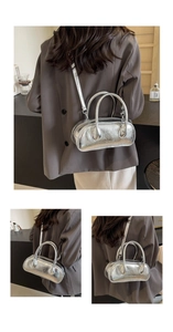 Detail of silver metallic bowling bag with crackled leather texture and crossbody strap