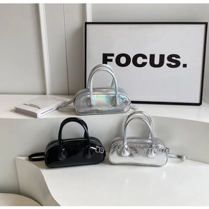 Three mini Boston bags in metallic silver and patent black on minimalist white stairs