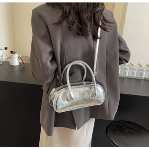 Detailed close-up of a silver metallic bowling bag with ZBKEPARIS logo and long strap