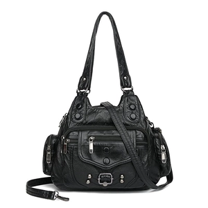 Vintage black washed leather tote bag with multi-pocket design and rivet details
