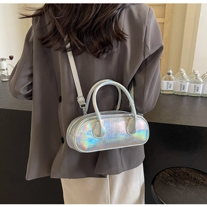 Detail shot of silver holographic bowling bag with crackle texture and metallic sheen