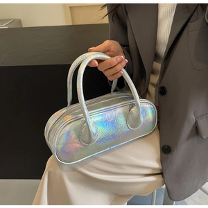 Detail shot of a holographic silver bowling bag with a laser finish and top handle design