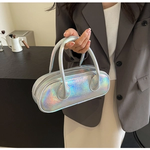 Macro shot of silver holographic mini bowling bag with metallic pleated texture
