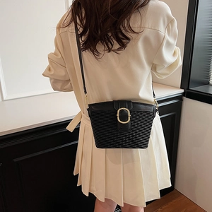 Chic black woven texture underarm bag for women with golden buckle and sleek leather strap