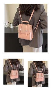 Detailed view of pink woven texture backpack with adjustable straps and metal buckles