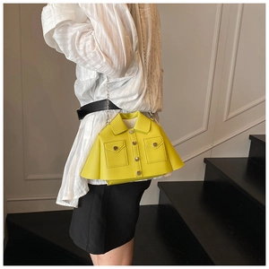 Detail of creative shirt-shaped crossbody bag in yellow with silver buttons and chain