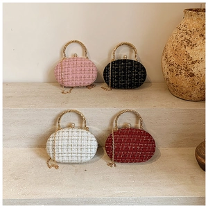 Elegante tweed clutch tassen met gouden metalen handvatten en kristallen sluiting