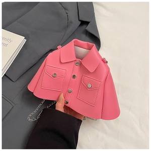 Close-up of pink mini jacket shaped crossbody bag with silver chain and button details