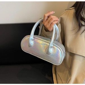 Detail showing laser iridescent texture and metallic finish on this bowling baguette bag