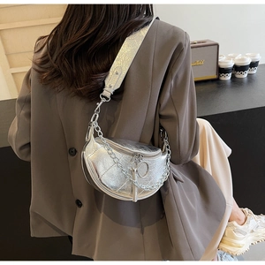 Silver metallic crescent bag with cracked leather texture and silver chain strap detail